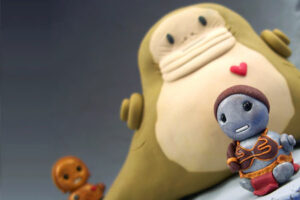 A picture of toy version of Jabba the Hutt and Princess Leia from a Return of the Jedi scene