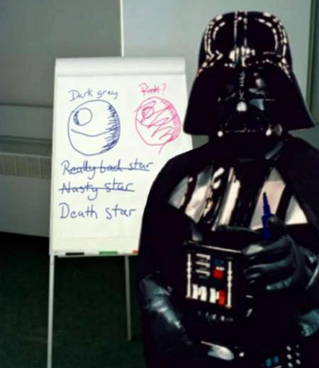 A spoof photograph of Darth Vader in front of a whiteboard with evidence of a session where the name of the Death Star had been the topic