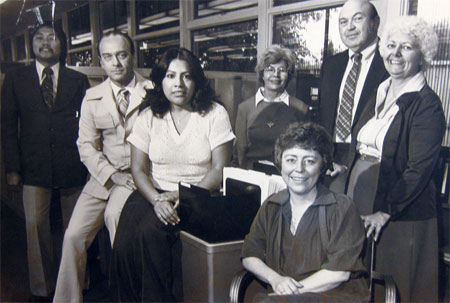 An 1970s black and white photograph of badly dressed office workers